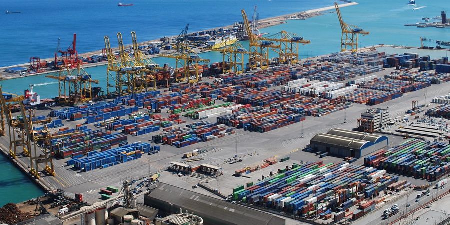 Aerial view of a container yard with rows of colourful containers at the Port of Barcelona