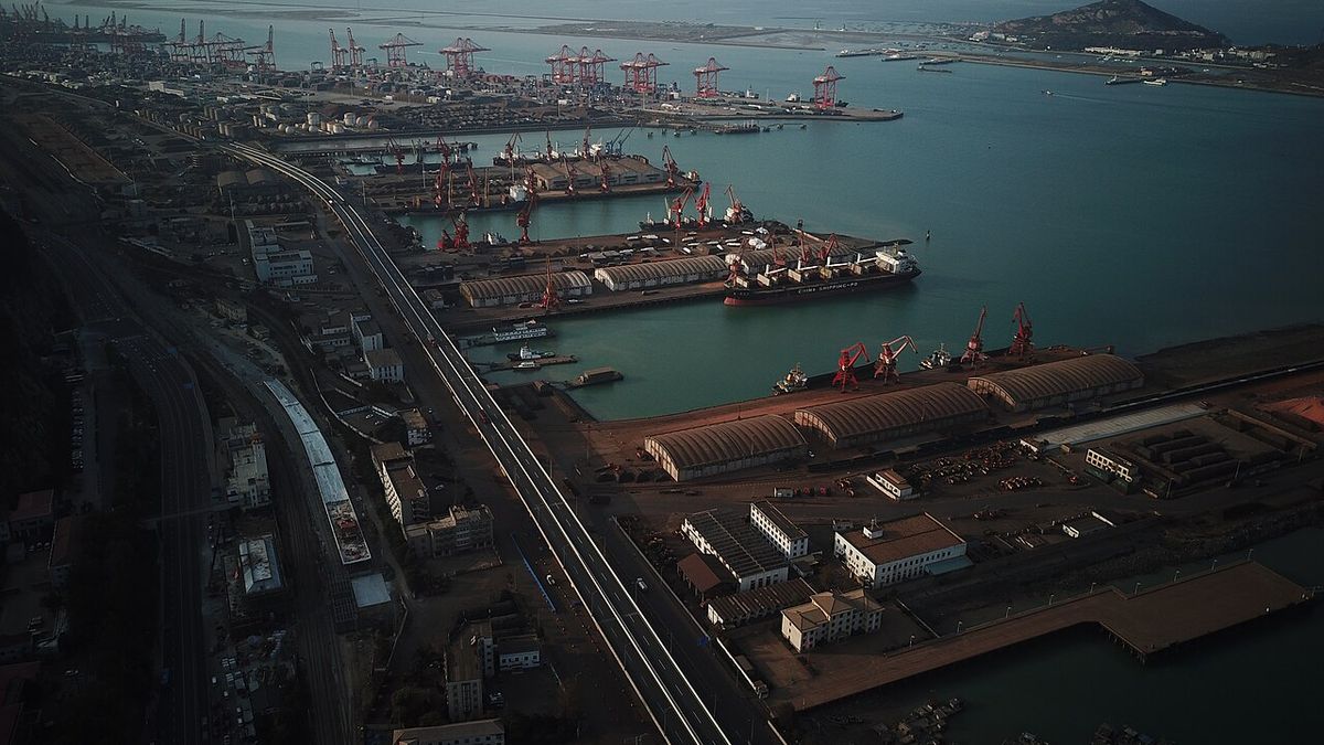 Aerial view over the Port of Lianyungang with berths, rail lines and cargo yards