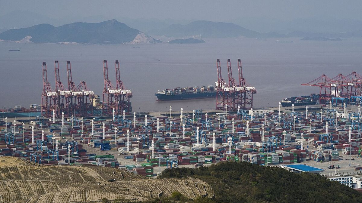 Container berths and gantry cranes at the Chuanshan area of Ningbo-Zhoushan Port, with islands behind
